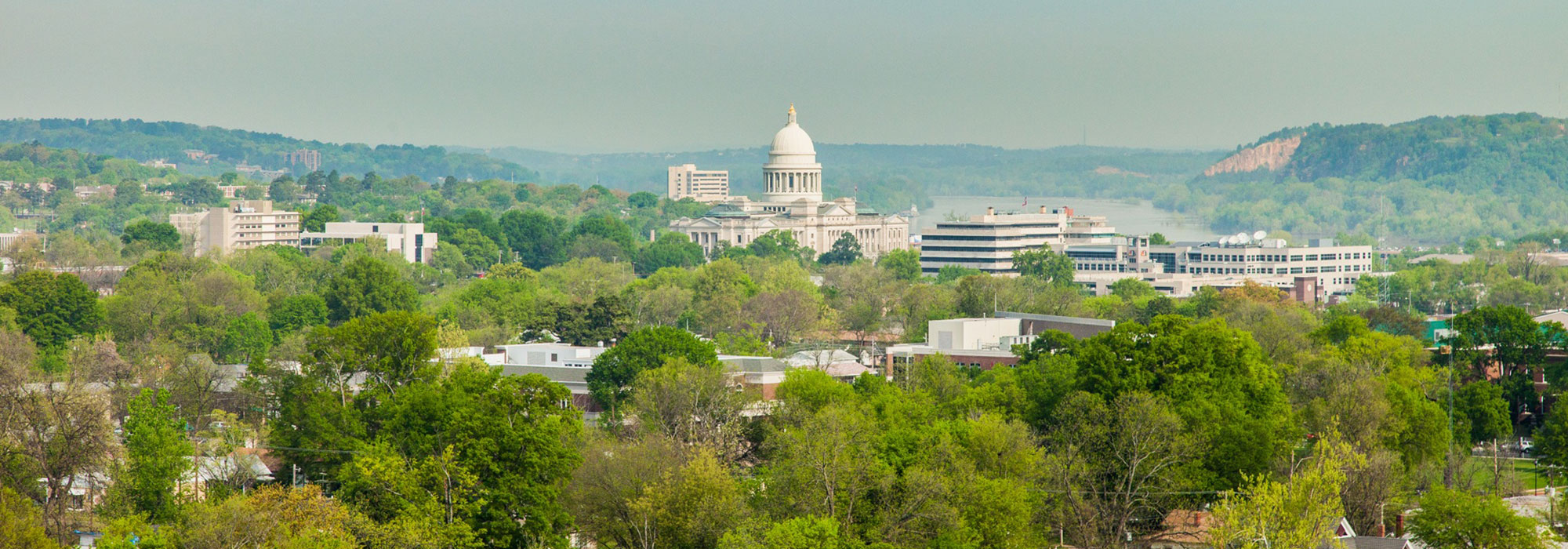 Arkansas State Capitol seen from afar on sunny summer day